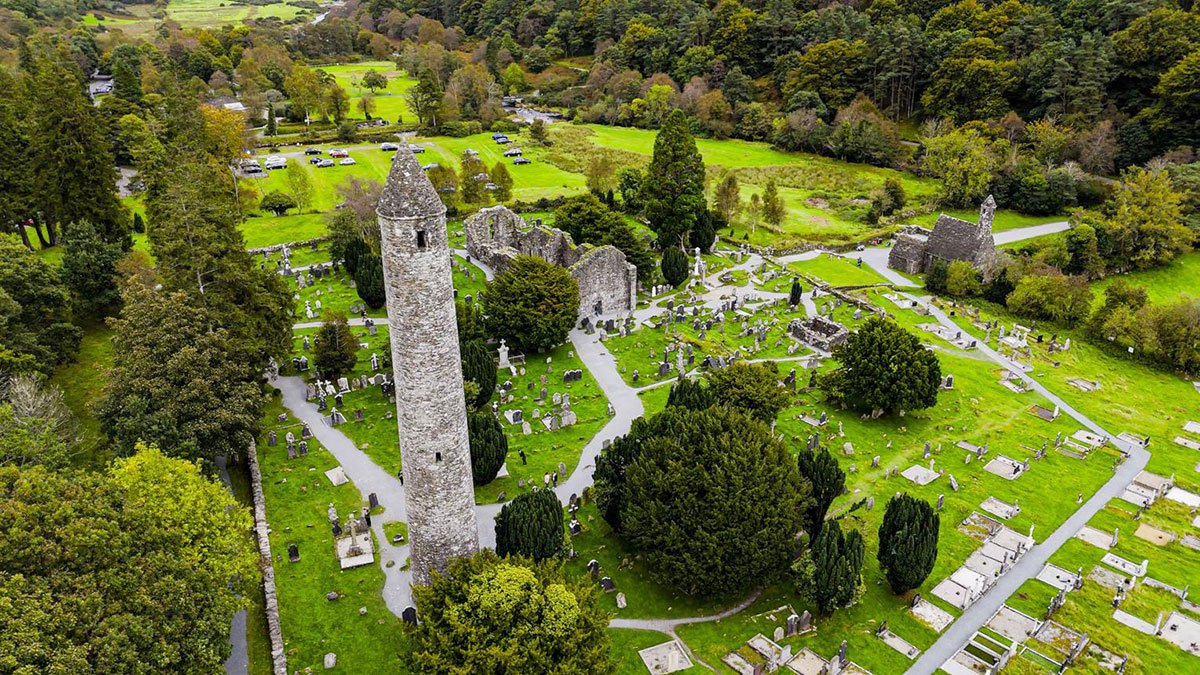 Historic round tower and monastic ruins at Glendalough in County Wicklow