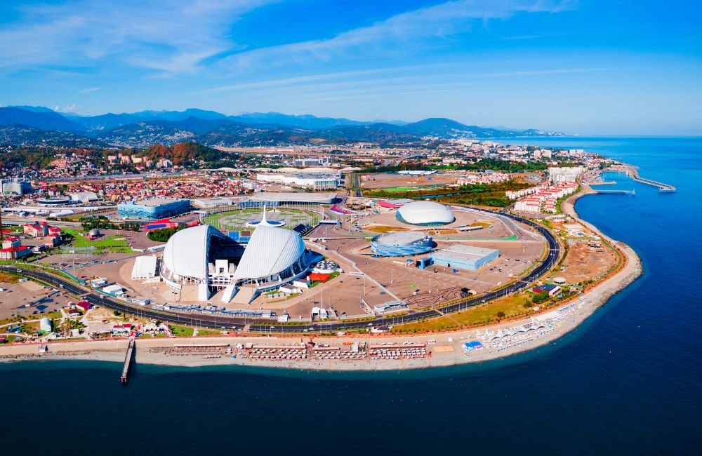 Aerial panoramic view of Sochi Olympic Park in Sirius, Russia, showing Fisht Stadium, Olympic sports venues and the Black Sea coastline.