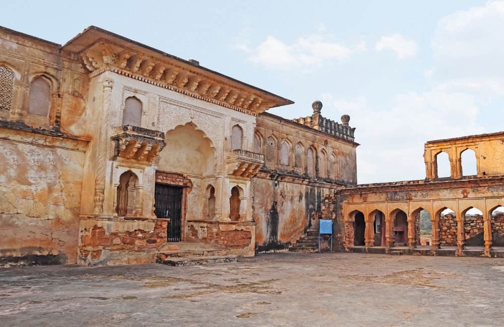 Historic stone gateway and carved temple architecture at Kalinjar Fort in Uttar Pradesh, India